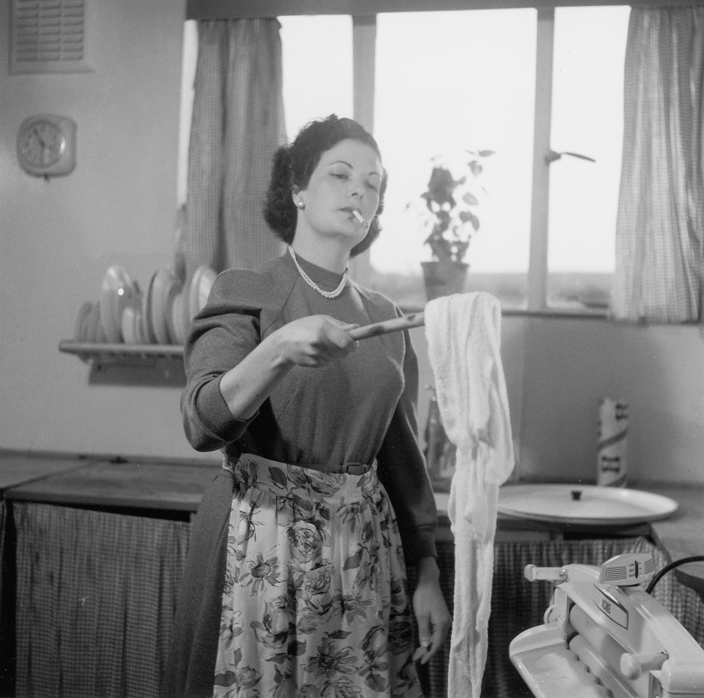 Housewife doing the laundry, 1954.