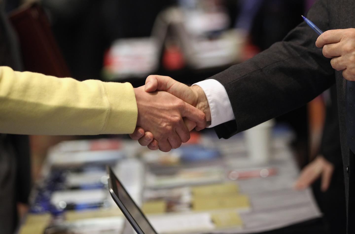 Job Seekers Look For Employment Opportunities At Career Fair