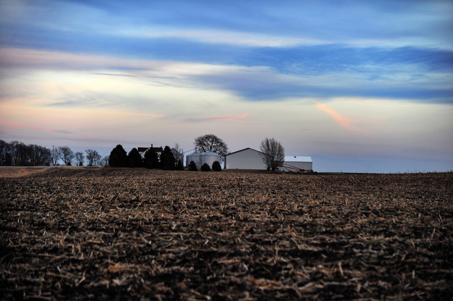 A farmhouse is picture at dusk in Ames,