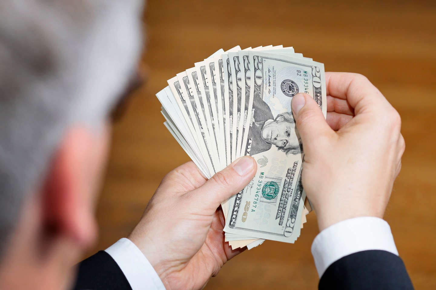 Businessman Holding US Dollars