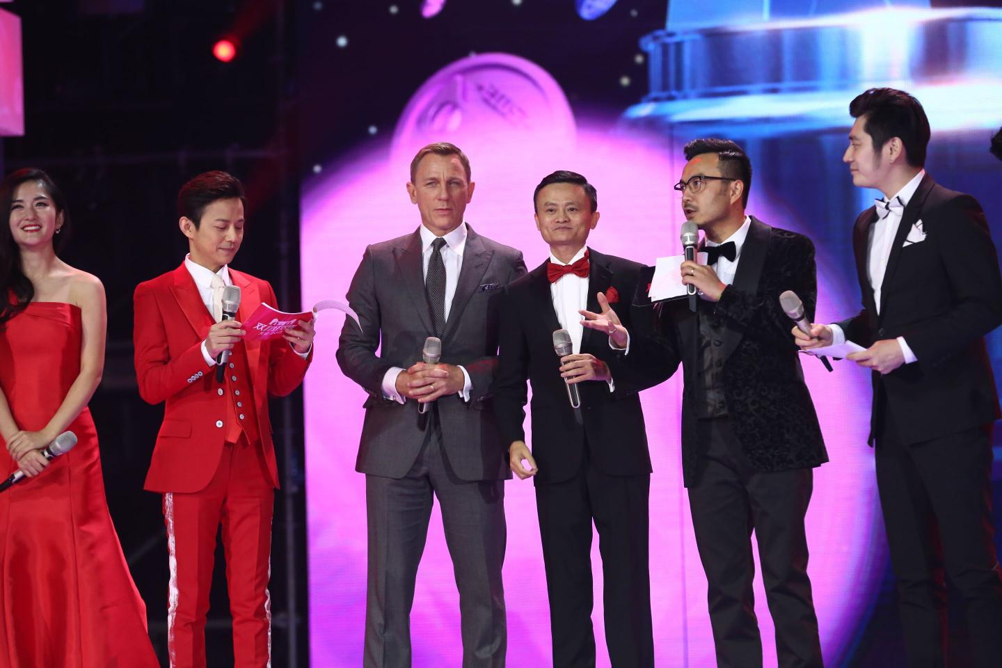 BEIJING, CHINA - NOVEMBER 10: (CHINA OUT) British actor Daniel Craig (L3) and Alibaba Chairman Jack Ma (R3) attend the ceremony of 2015 Tmall 11.11 Global Shopping Festival at the Water Cube on November 10, 2015 in Beijing, China. Alibaba Group and Hunan television held a ceremony at the Water Cube (aka National Aquatics Center) for the 2015 Tmall 11.11 Global Shopping Festival which attracted consumers to shop on Tmall.com with discounts on November 11 which was also called the "Singles Day". (Photo by ChinaFotoPress)***_***