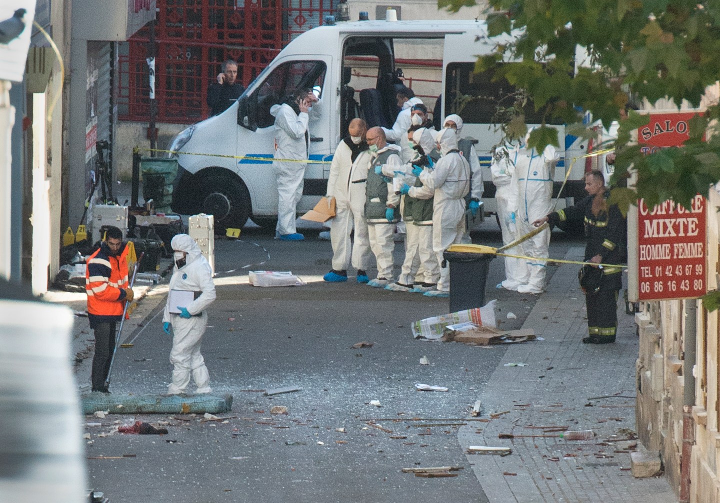 PARIS, FRANCE - NOVEMBER 18: Police technicians gather evidenc