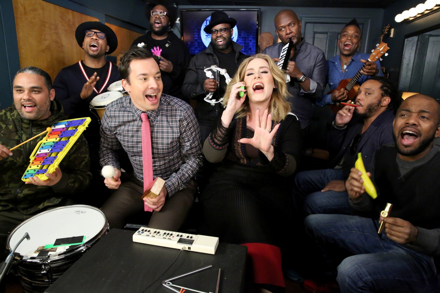 THE TONIGHT SHOW STARRING JIMMY FALLON -- Episode 0374 -- Pictured: (l-r) Host Jimmy Fallon and The Roots sing with Adele during the Music Room bit on November 24, 2015 -- (Photo by: Douglas Gorenstein/NBC/NBCU Photo Bank)