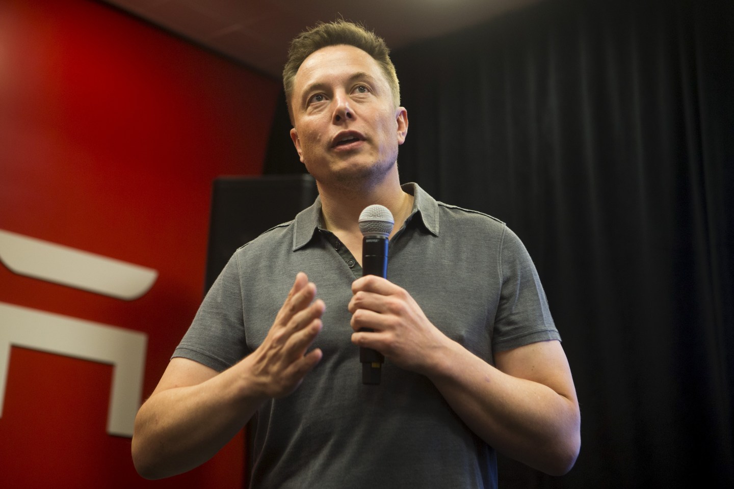 Tesla CEO Elon Musk speaks about new Autopilot features during a Tesla event in Palo Alto