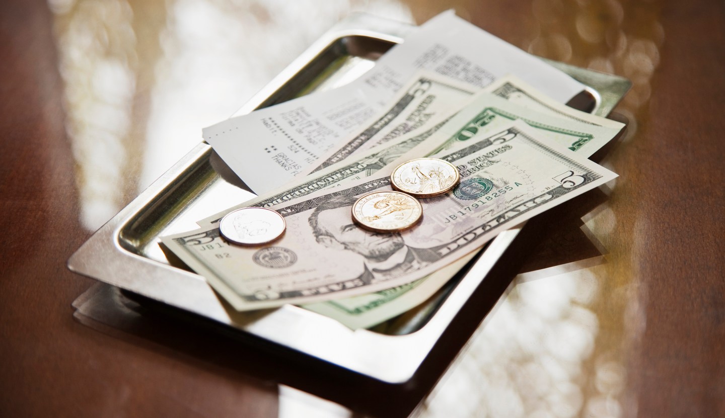 Tray with receipt and cash