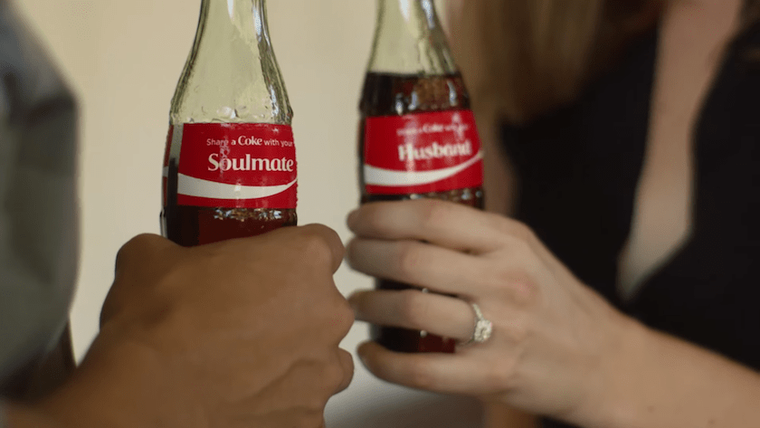 In one part of the Coke ad, a man proposes to his girlfriend