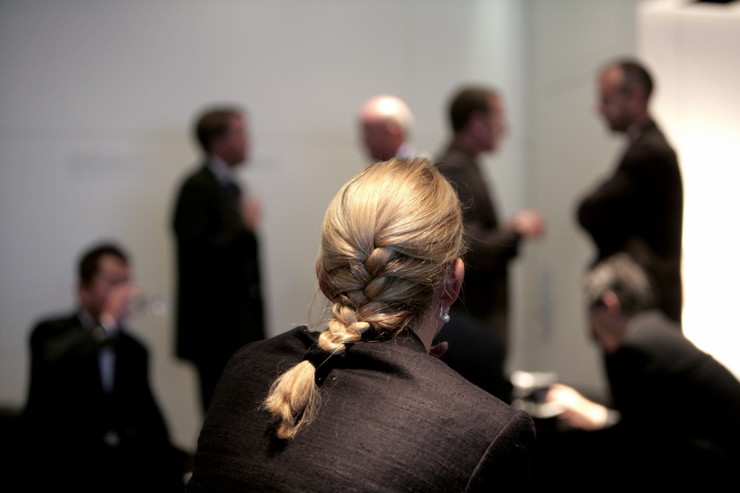 GERMANY, FRANKFURT, Businesswomen with her male colleagues during a meeting.