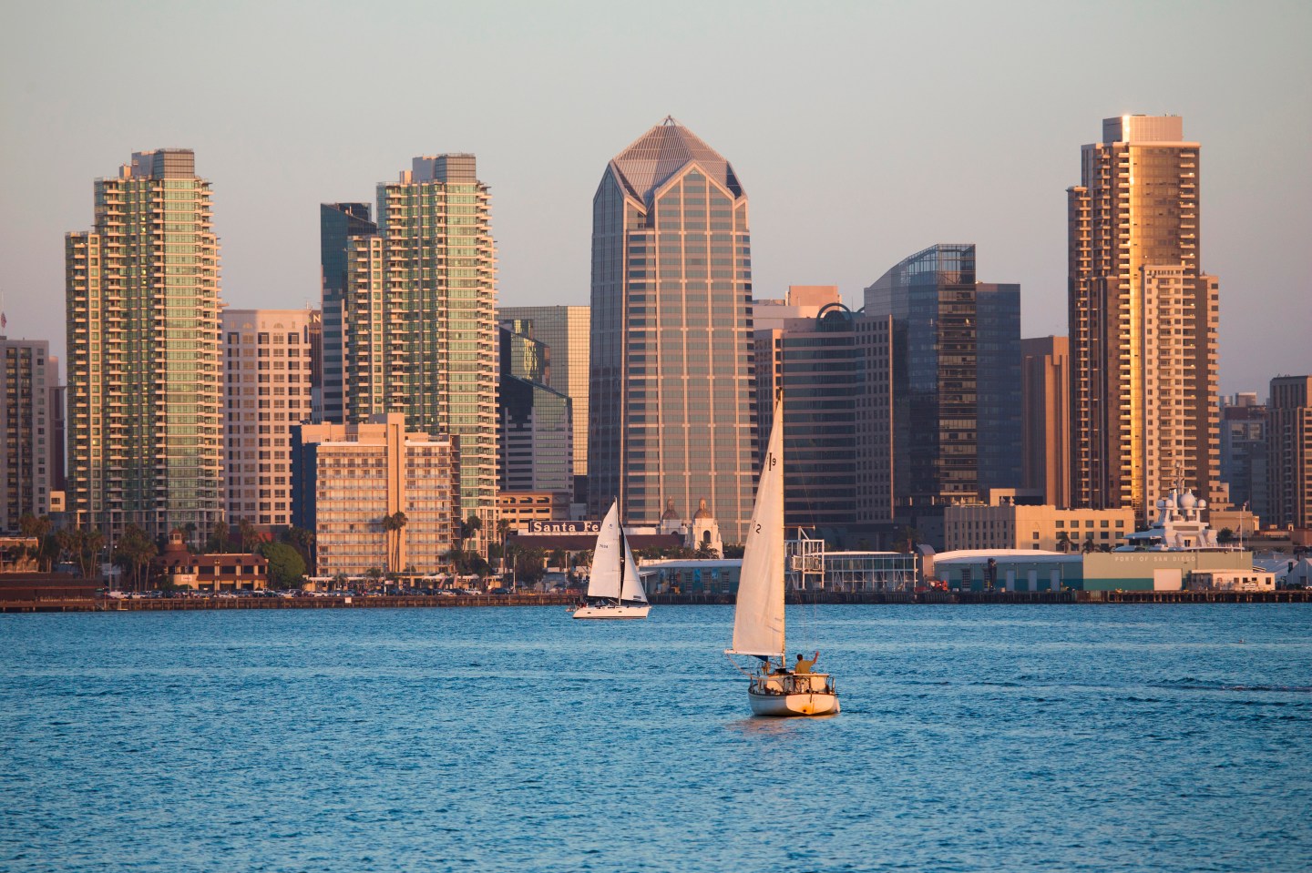 Scenic San Diego skyline, sailboat and waterfront, Pacific Ocean at sunset, California
