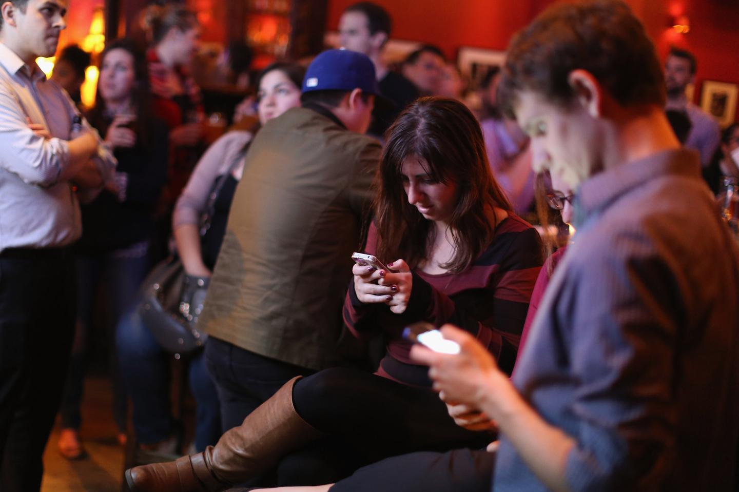 Young adults at a party at the Local 16 bar and restaurant Oct. 13, 2015 in Washington, DC.