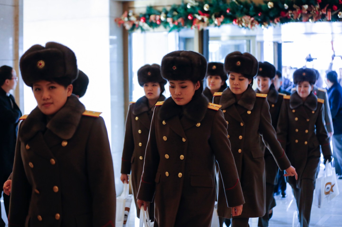 BEIJING, CHINA - DECEMBER 11: (CHINA OUT) Members of the North Korean female music group Moranbong Band arrive at a hotel after concert rehearsal on December 11, 2015 in Beijing, China. The Moranbong Band will perform at the National Centre for the Performing Arts from December 12 to 14. (Photo by ChinaFotoPress)***_***