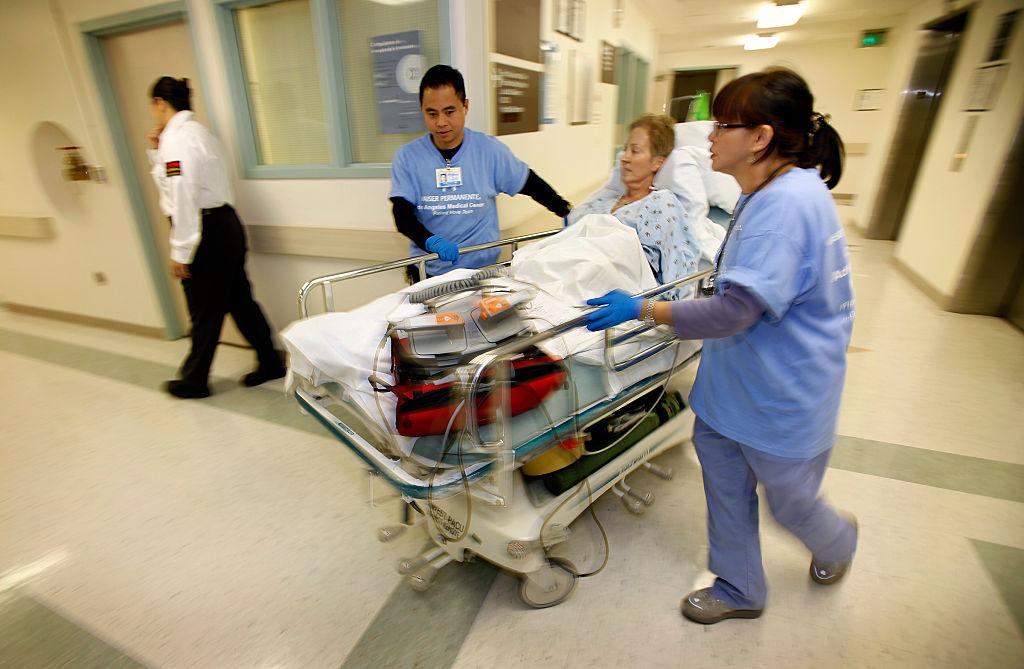 Patient Karen Ballog, 57yearsold is moved from her room in the cardiac care unit through the hall