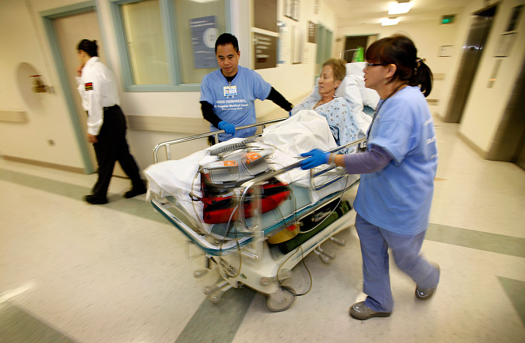 Patient Karen Ballog, 57yearsold is moved from her room in the cardiac care unit through the hall