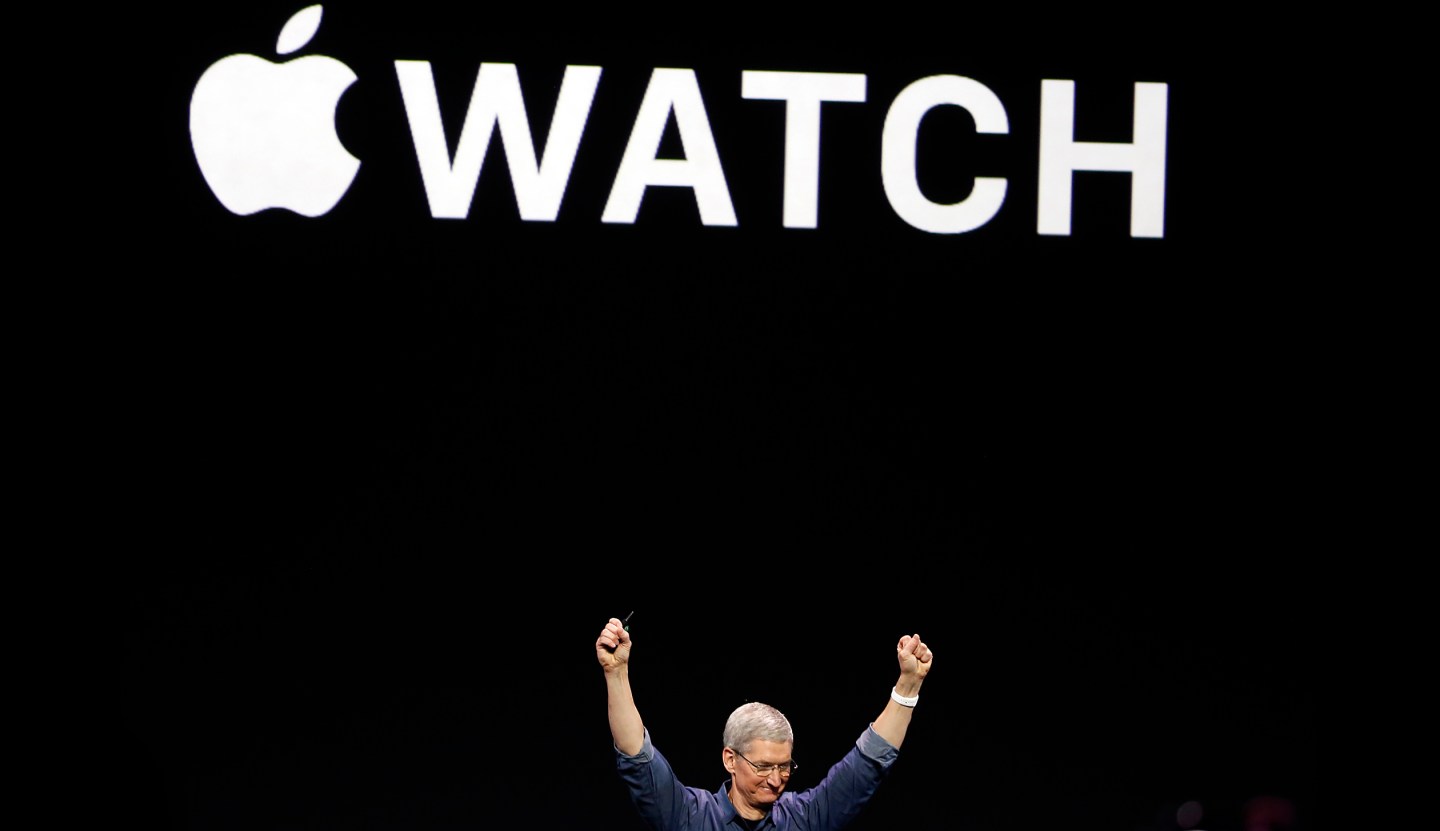 Apple Chief Executive Tim Cook gestures as he unveils the Apple Watch during an Apple event at the Flint Center in Cupertino