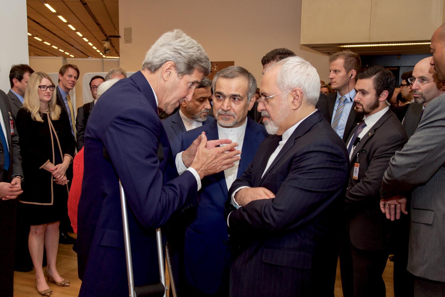 John Kerry speaks with Hossein Fereydoun and Iranian Foreign Minister Javad Zarif before the Secretary and Foreign Minister addressed an international press corps gathered at the Austria Center in Vienna