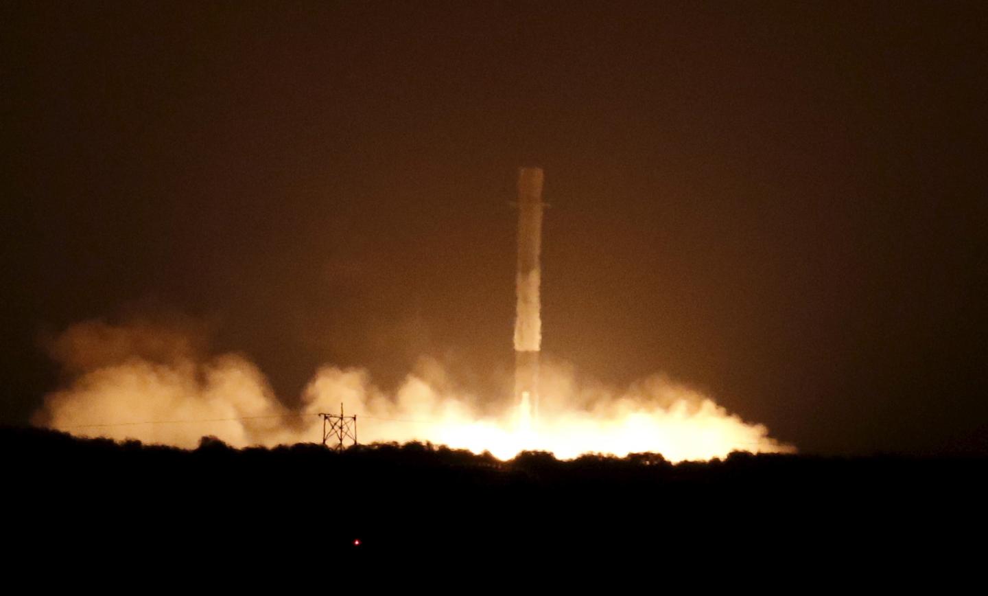 The first stage of the SpaceX Falcon 9 rocket returns to land at Cape Canaveral Air Force Station in Florida