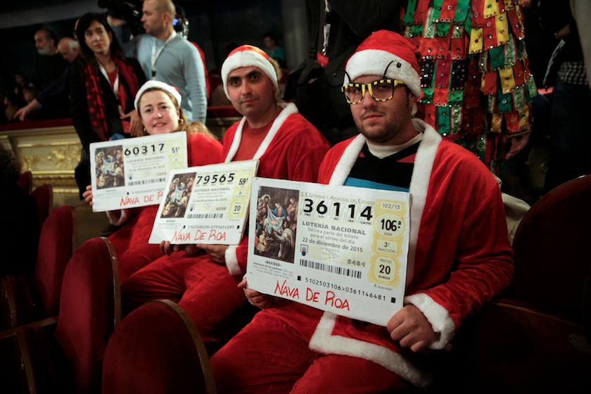 People dressed in costumes attend the draw of Spain's Christmas Lottery "El Gordo" in Madrid