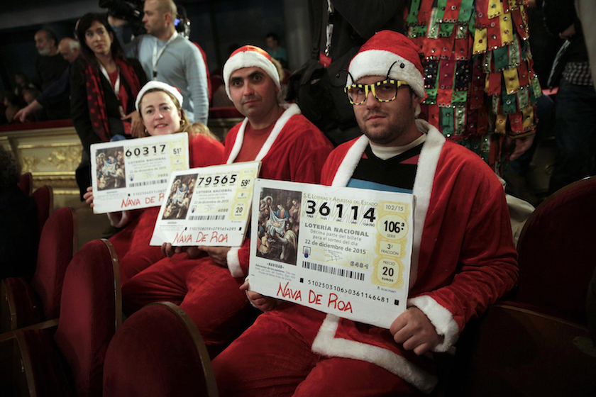 People dressed in costumes attend the draw of Spain's Christmas Lottery "El Gordo" in Madrid