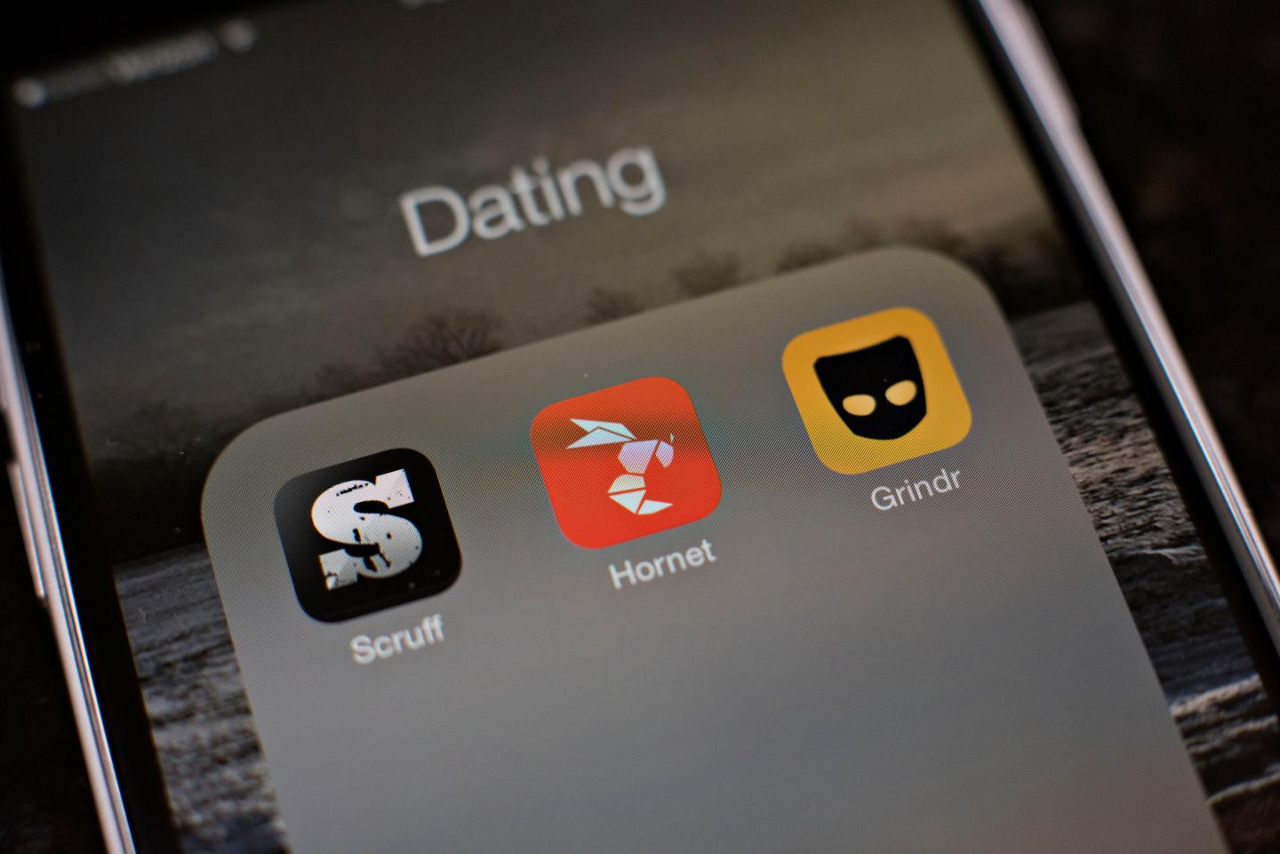 The gay dating apps Scruff, Hornet, and Grindr are displayed on an Apple Inc. iPhone 6 in Tiskilwa, Illinois, U.S., on Tuesday, Jan. 20, 2015. For gay men flocking to smartphone dating applications, making a connection increasingly comes with messages about HIV status, testing and drug regimens. Some apps let users declare their status, remind them to get tested and give locations of the closest clinics. Photographer:  Daniel Acker/Bloomberg