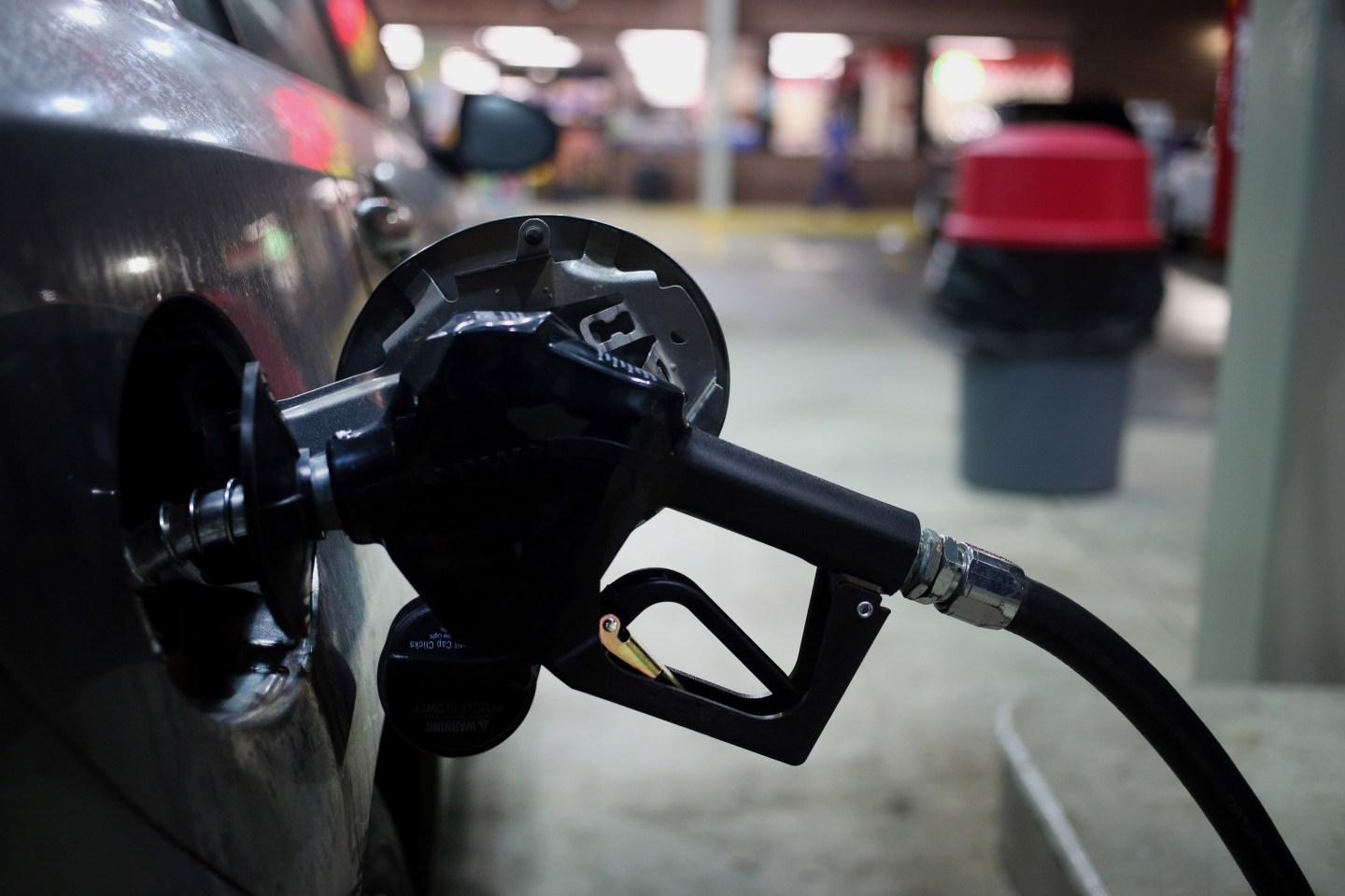A gasoline pump nozzle dispenses fuel into a vehicle at a Hess gas station in Gordonsville, Tennessee, U.S. on Saturday, Oct. 24, 2015. Hess is scheduled to release their quarterly earnings on . Photographer: Luke Sharrett/Bloomberg