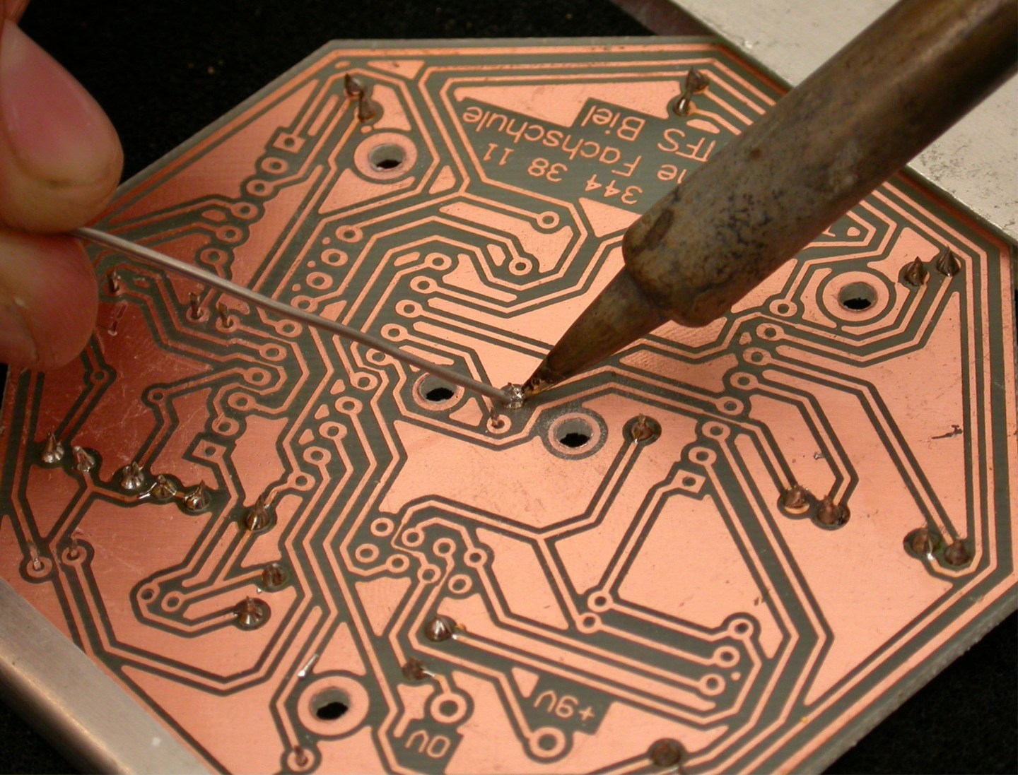 Soldering a connection on a PCB 2005