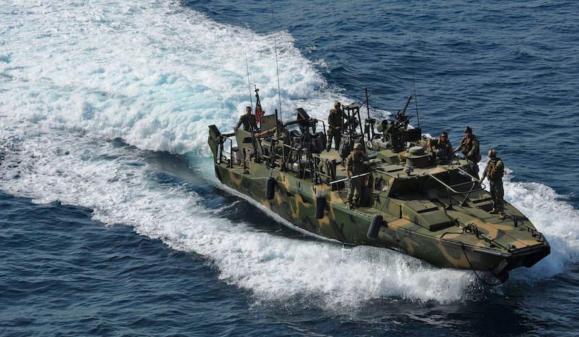 U.S. Navy handout photo of a riverine command boat from Riverine Detachment 23 operates during a maritime air support operations center exercise in the Arabia Gulf
