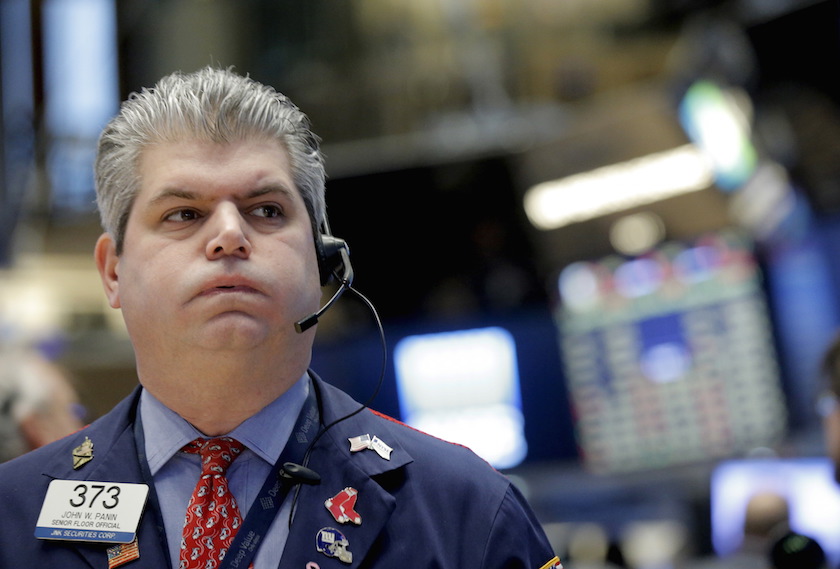 A trader works on the main trading floor of the New York Stock Exchange shortly after the opening bell of the trading session in New York
