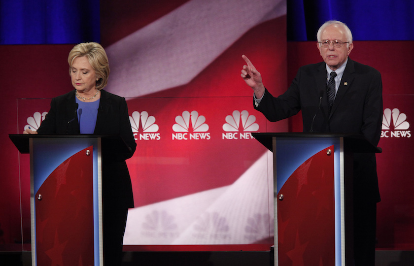 Democratic U.S. presidential candidate and former Secretary of State Hillary Clinton takes notes as she listens to rival candidate U.S. Senator Bernie Sanders speak at the NBC News - YouTube Democratic presidential candidates debate in Charleston
