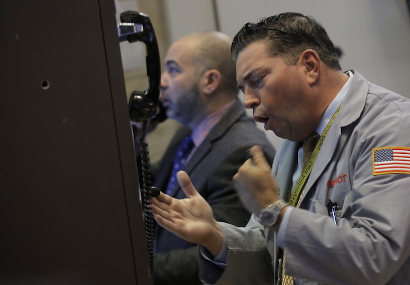 Traders work on the floor of the New York Stock Exchange