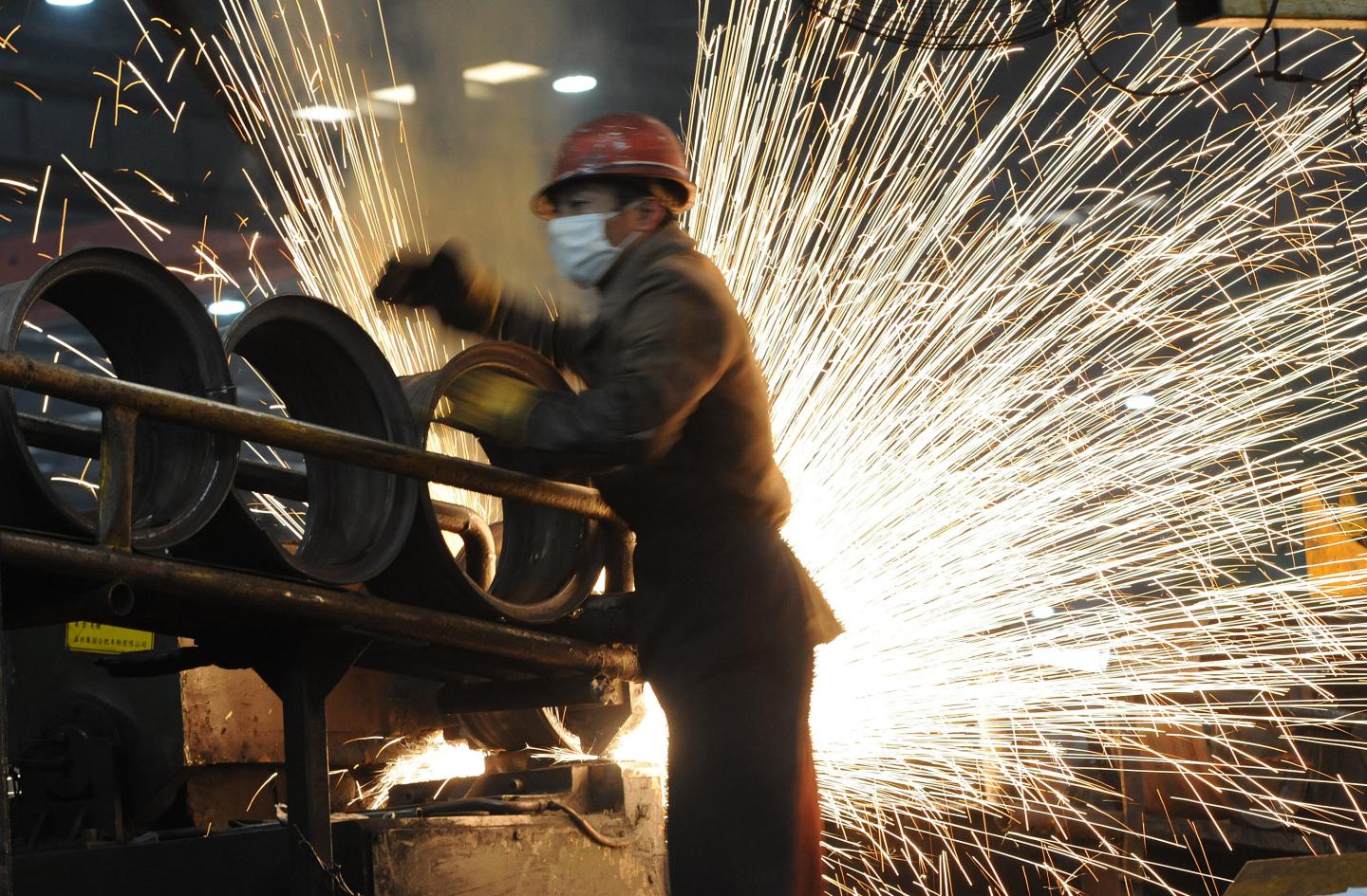 A Chinese worker goes about his chores at a steel mill in Hefei, in eastern China's Anhui province.