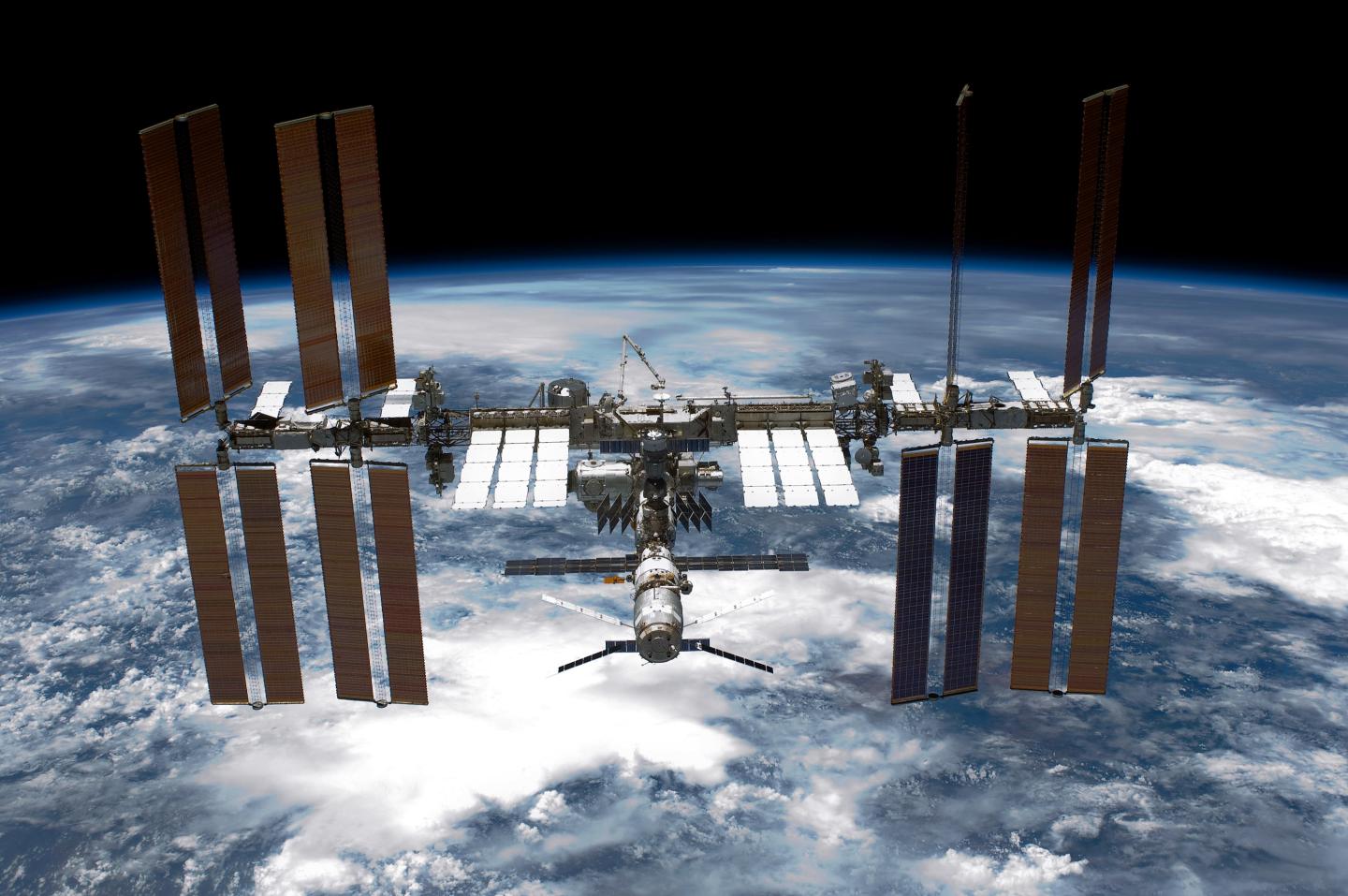 IN SPACE - MAY 29:  In this handout provided by National Aeronautics and Space Administration (NASA), back dropped by planet Earth the International Space Station (ISS) is seen from NASA space shuttle Endeavour after the station and shuttle began their post-undocking relative separation May 29, 2011 in space. After 20 years, 25 missions and more than 115 million miles in space, NASA space shuttle Endeavour is on the last leg of its final flight to the International Space Station before being retired and donated to the California Science Center in Los Angeles. Capt. Mark E. Kelly, U.S. Rep. Gabrielle Giffords' (D-AZ) husband, has lead mission STS-134 as it delivered the Express Logistics Carrier-3 (ELC-3) and the Alpha Magnetic Spectrometer (AMS-2) to the International Space Station. (Photo by NASA via Getty Images)