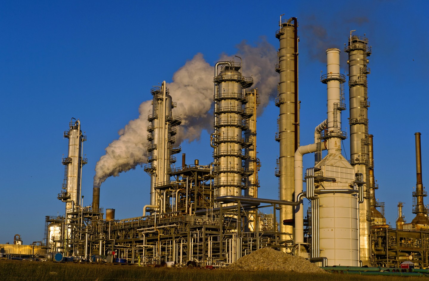 Views Of Tankers & Refineries As Oil Trades Near 12-Year Low