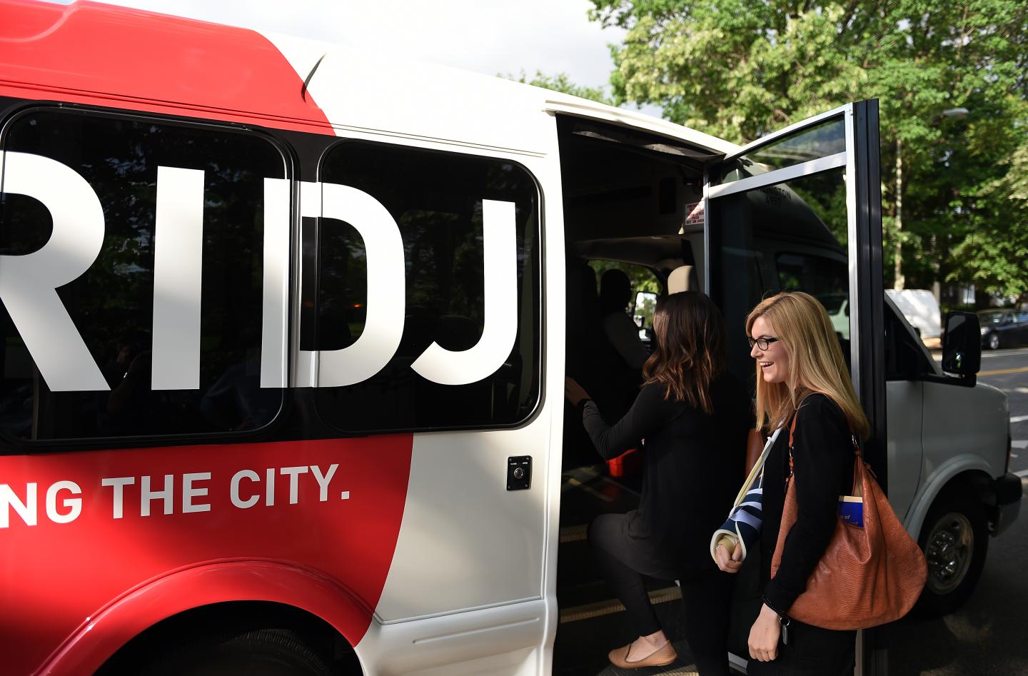 WASHINGTON, DC - May 13: Emily Bastina, 25, boards a Bridj bus