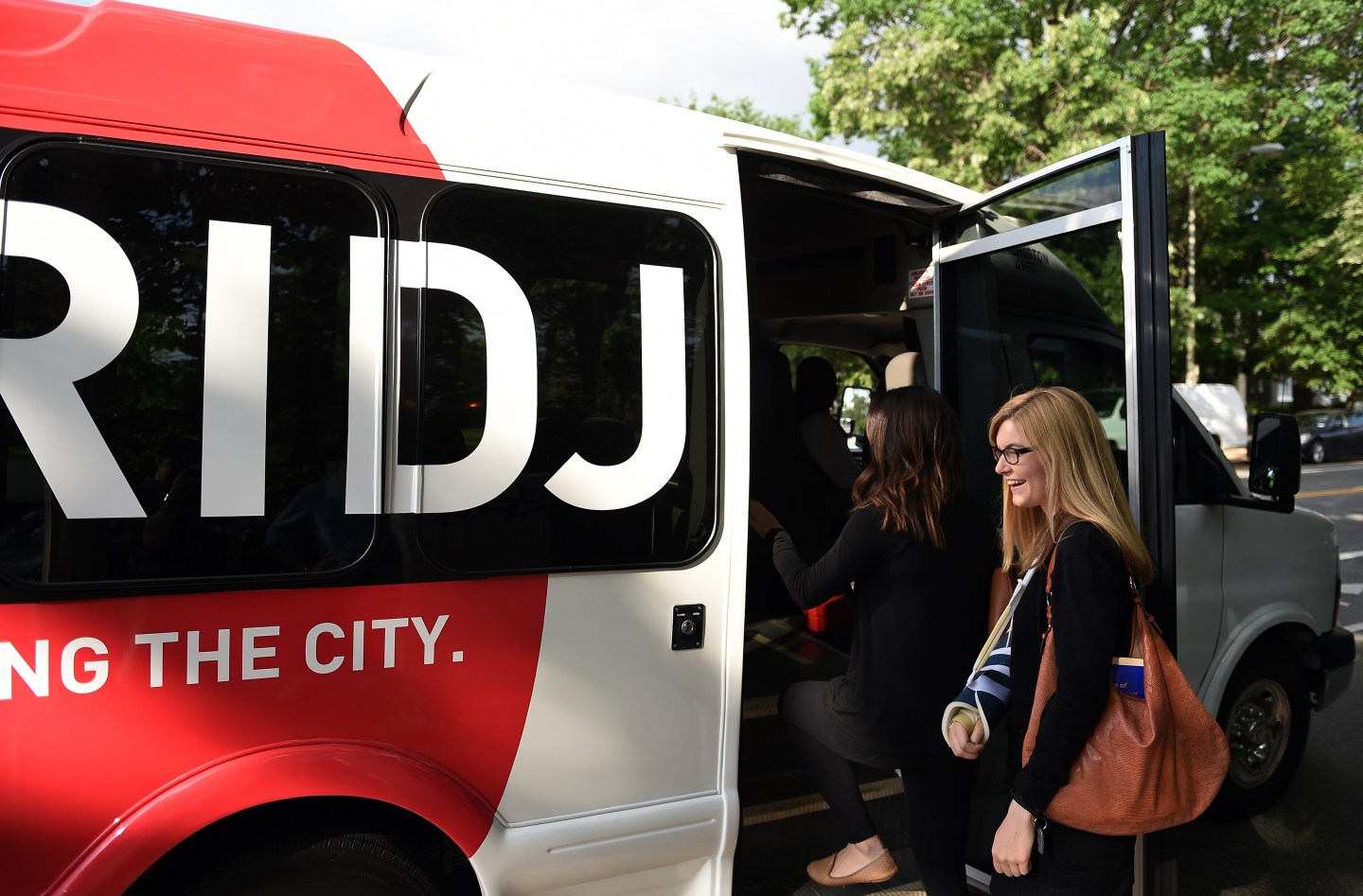 WASHINGTON, DC - May 13: Emily Bastina, 25, boards a Bridj bus