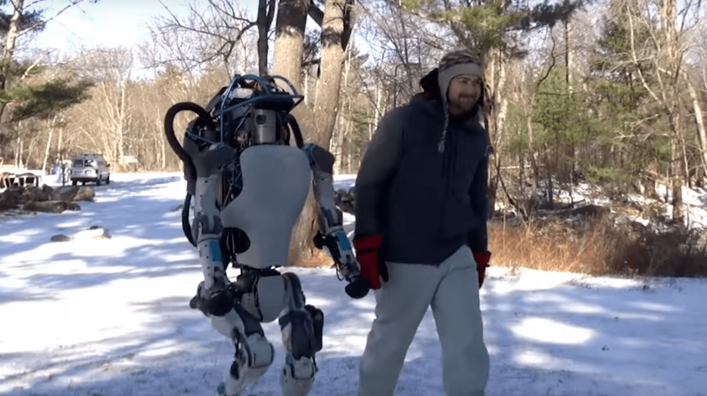 Boston Dynamics' new humanoid Atlas robot takes a stroll in the snow.