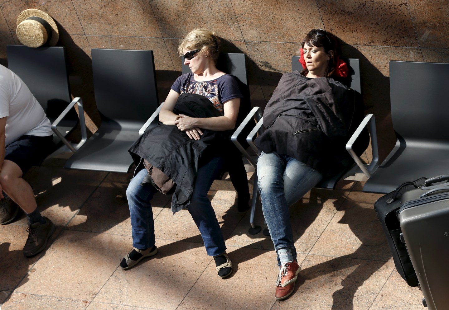 Stranded passengers sleep at Zaventem international airport near Brussels
