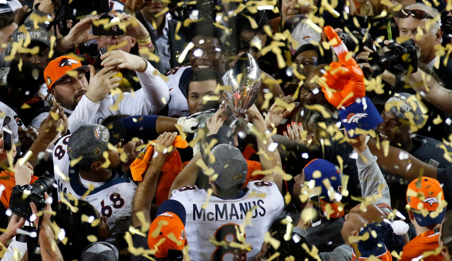 Denver Broncos' Brandon McManus holds the Vince Lombardi Trophy after the Broncos defeated the Carolina Pathers in the NFL's Super Bowl 50 football game in Santa Clara