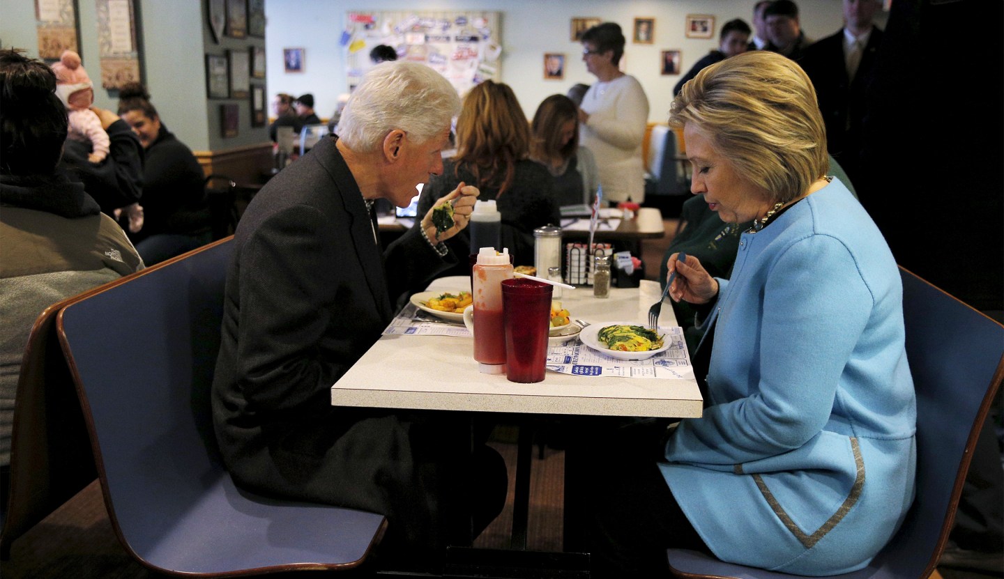 U.S. Democratic presidential candidate Hillary Clinton and her husband, former U.S. President Bill Clinton eat breakfast at the Chez Vachon restaurant in Manchester