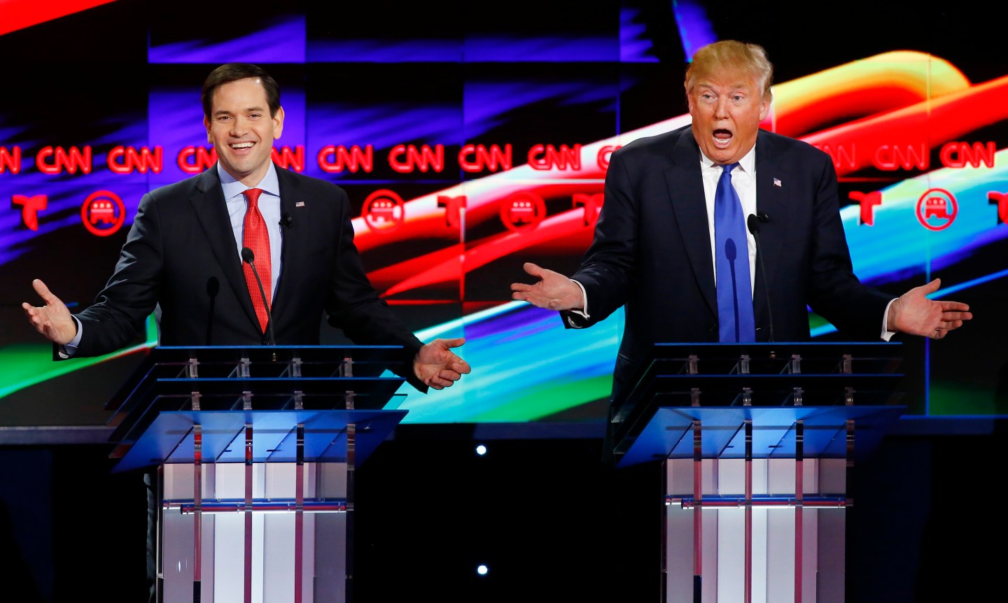 Republican U.S. presidential candidates Rubio and Trump react to each other as they discuss an issue during the debate sponsored by CNN for the 2016 Republican U.S. presidential candidates in Houston