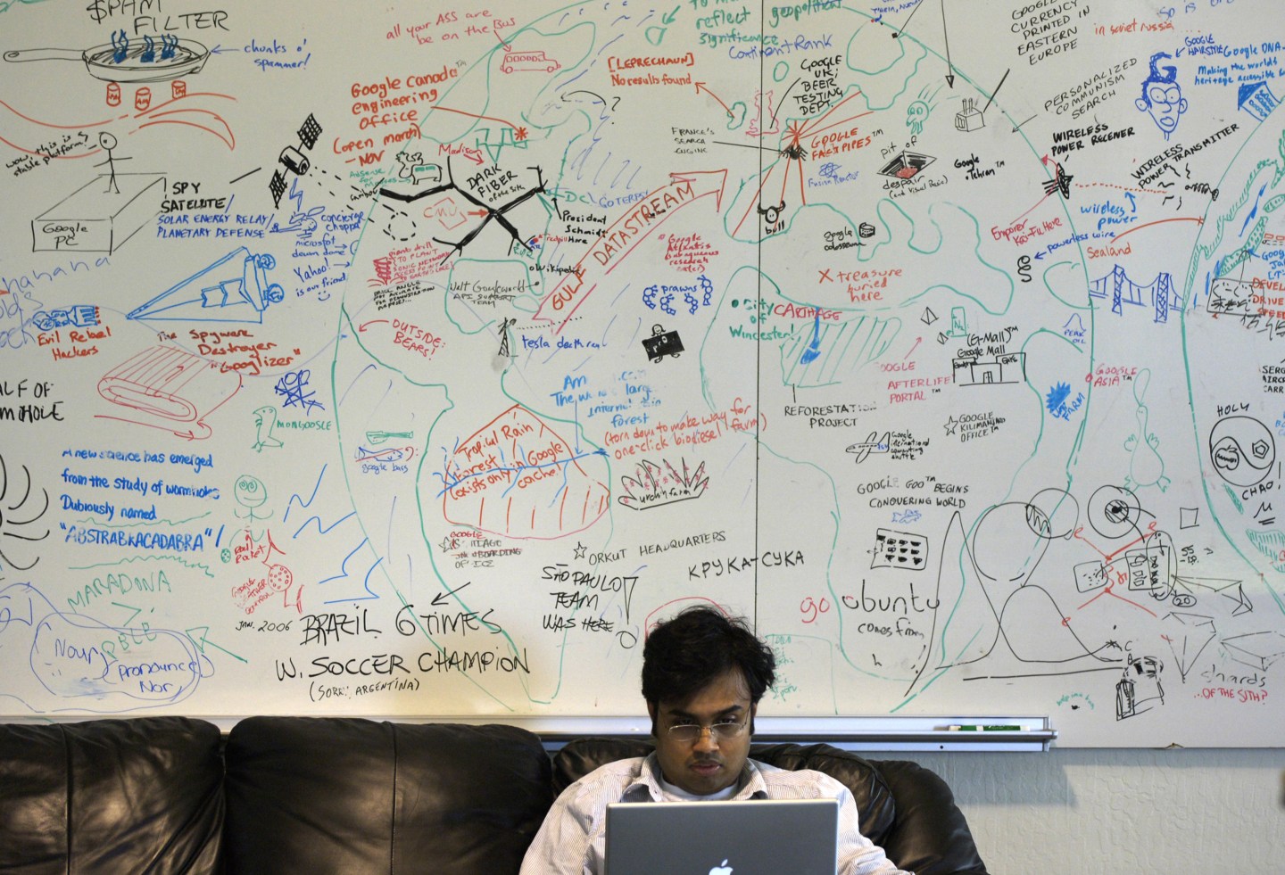 Google employee Pranay Gupta works on his laptop in front of