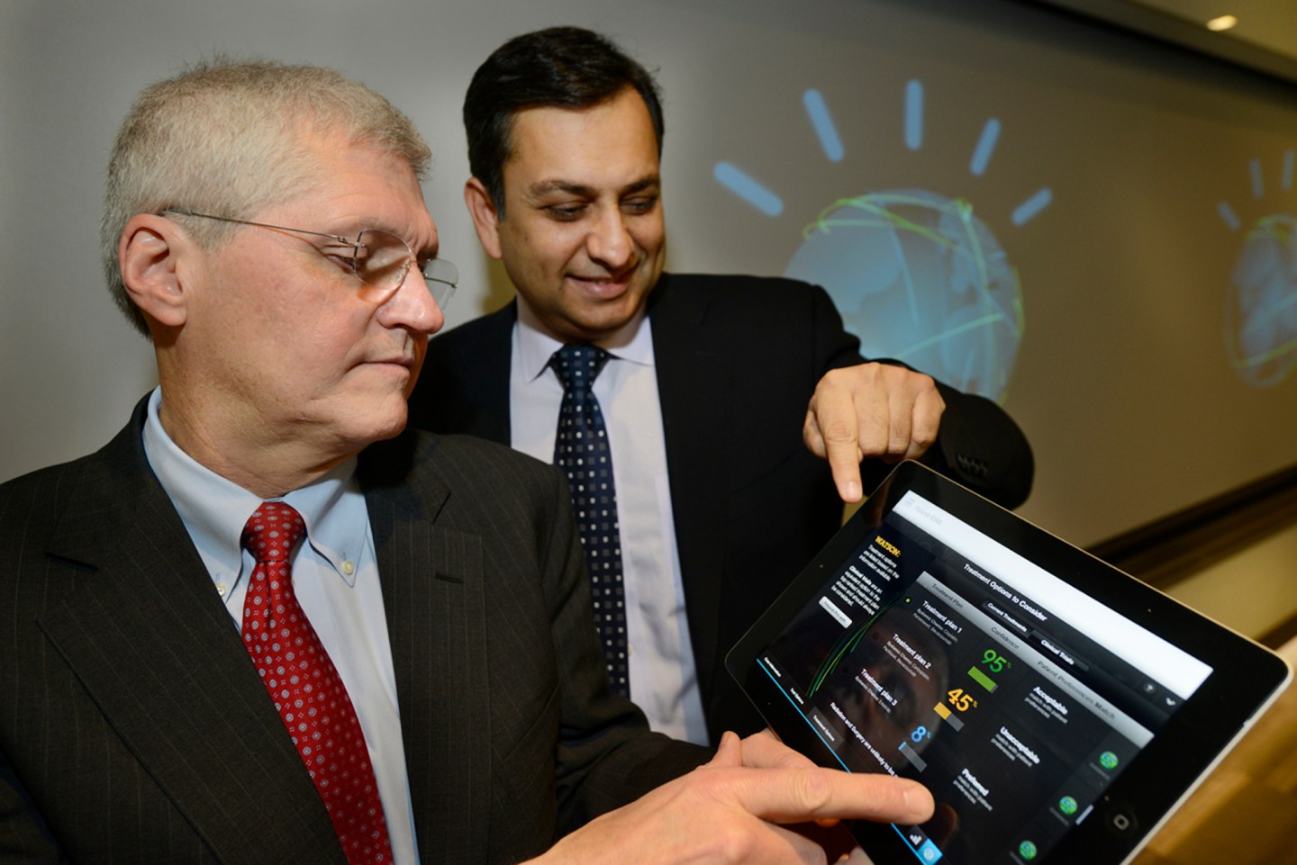 Mark Kris, MD, Chief of Thoracic Oncology, Memorial Sloan-Kettering Cancer Center (LEFT) and Manoj Saxena, IBM General Manager, Watson Solutions (RIGHT) work with the first Watson-based cognitive computing solution for oncology. IBM, Memorial Sloan-Kettering and WellPoint today introduced the first commercially based products based on Watson at an IBM health care forum in New York City. (Credit: Jon Simon/Feature Photo Service)
