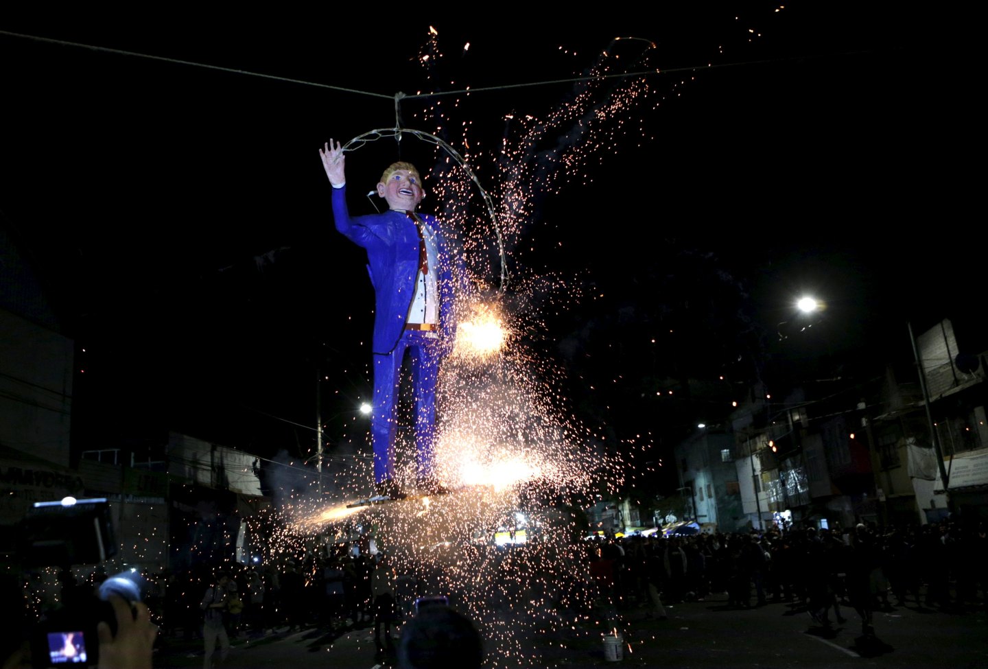 Mexicans prepare an effigy of U.S. Republican presidential hopeful Donald Trump before burning it as they celebrate an Easter ritual late on Saturday in Mexico City's poor La Merced neighborhood