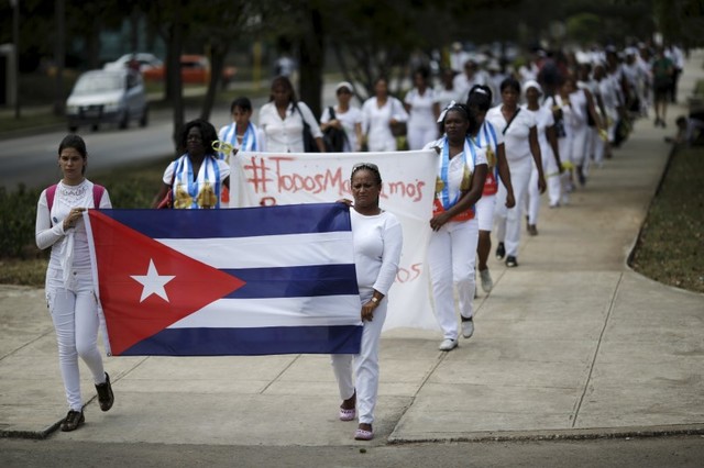 Members of the 'Ladies in White' dissident group march in Havana