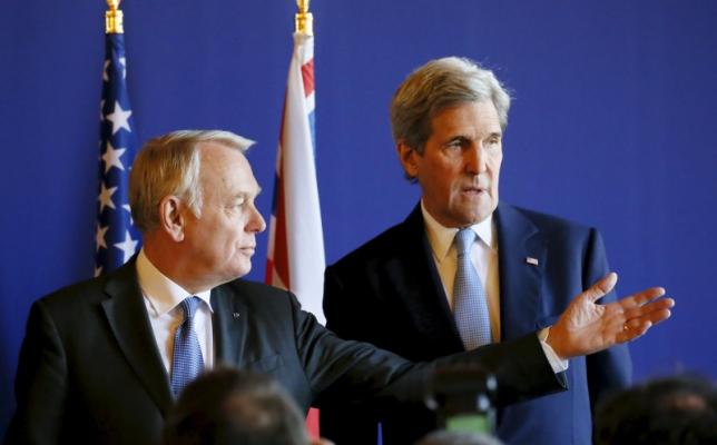French Foreign Minister Jean-Marc Ayrault and U.S. Secretary of State John Kerry attend a news conference at the Quai d'Orsay ministry in Paris