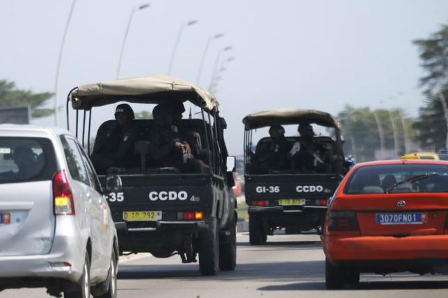 Security forces drive towards Grand Bassam in Abidjan