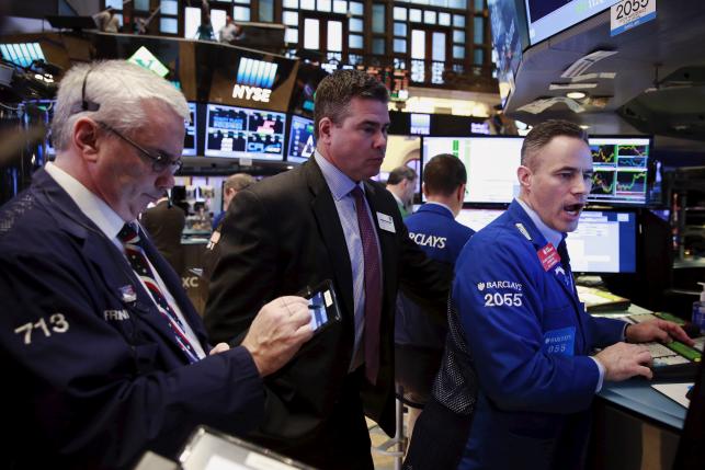 Traders work on the floor of the New York Stock Exchange shortly after the opening bell in New York