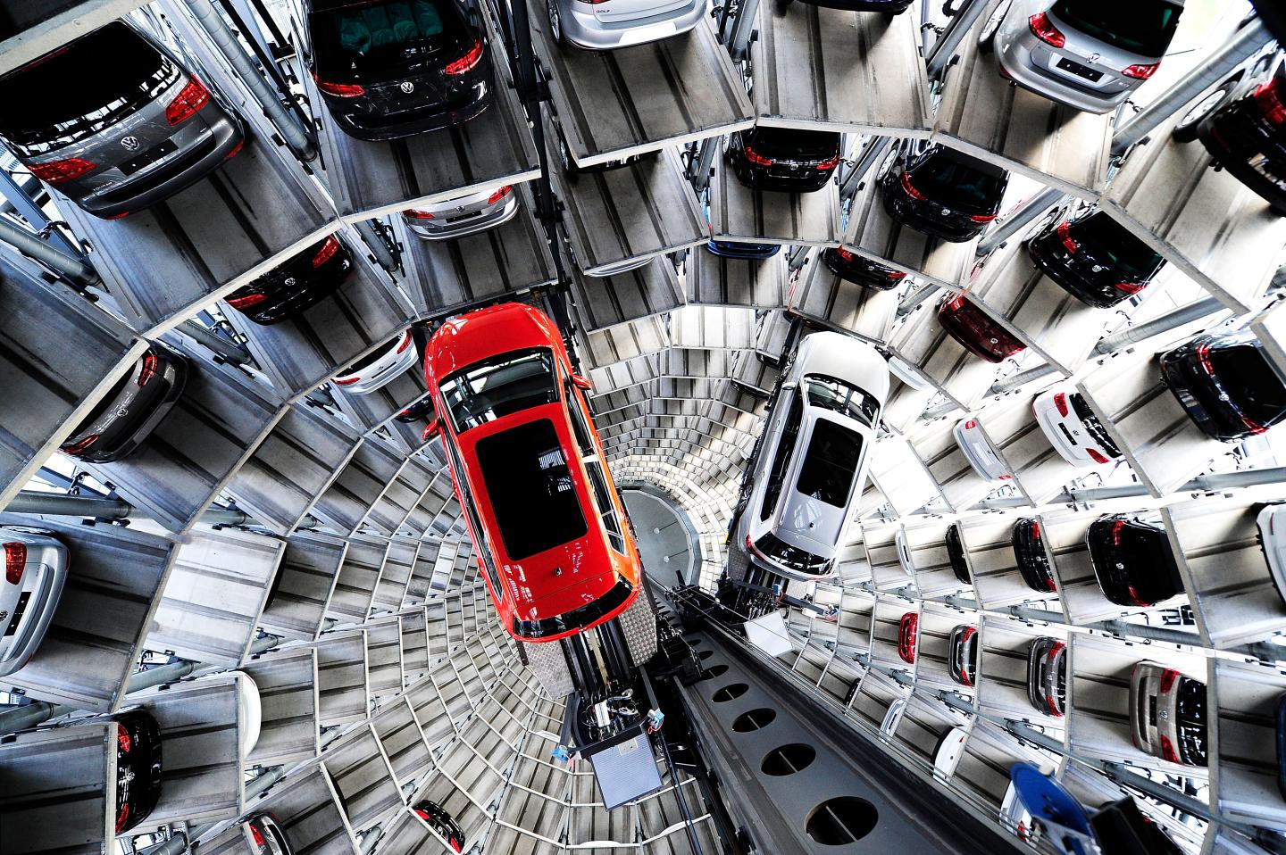 Brand new Volkswagen cars stand stored in a tower at the Volkswagen Autostadt complex near the Volkswagen factory on March 10, 2015 in Wolfsburg, Germany. Volkswagen is Germany's biggest carmaker and is scheduled to announce financial results for 2014 later this week. Customers who buy a new Volkswagen in Germany have the option of coming to the Autostadt customer service center in person to pick up their new car.