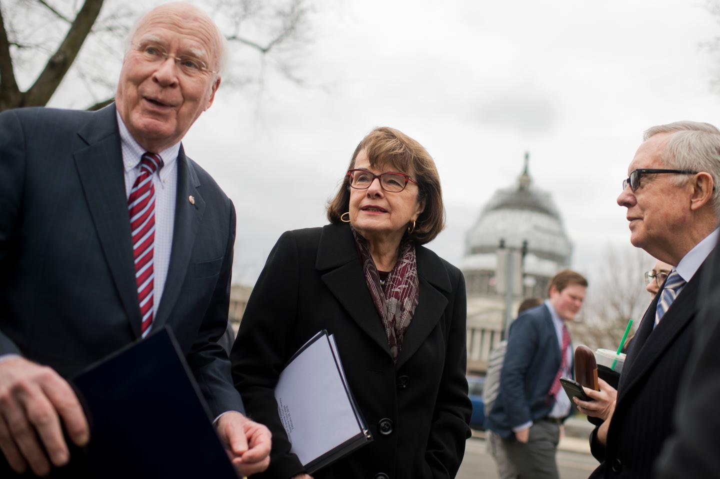 UNITED STATES - FEBRUARY 25: From left, Sens. Patrick Leahy, D-Vt., Dianne Feinstein, D-Calif., and Senate Minority Leader Harry Reid, D-Nev., along with other Senate Democrats hold a news conference outside of the Supreme Court to call on Senate Republicans to allow a hearing and vote on President Obama's nominee to replace the late Justice Antonin Scalia, February 25, 2016. (Photo By Tom Williams/CQ Roll Call)