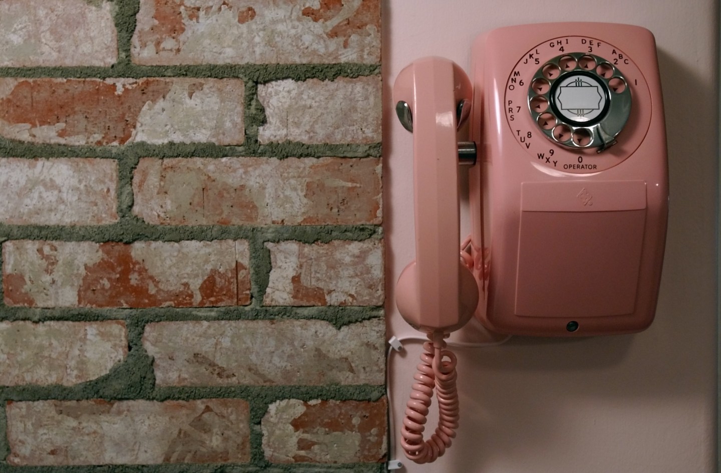Brick tiles and a rotary phone add to the 50s farmhouse kitchen feel at the Van De Yacht's home in N