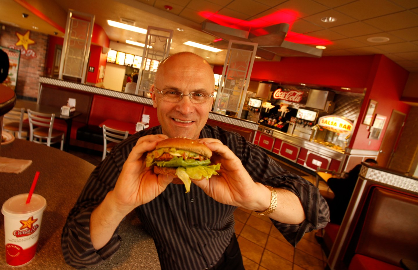 Andy Puzder, President of CKE Restaurants at a Carls Jr. Restaurant in Carpinteria with a turkey bu