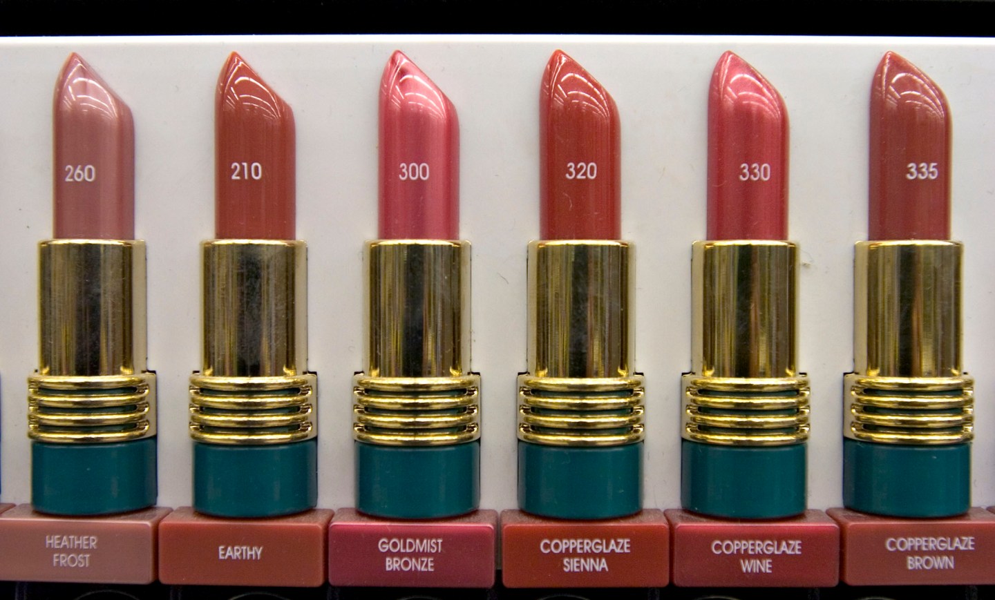 Revlon lipstick color samples are displayed in the cosmetics
